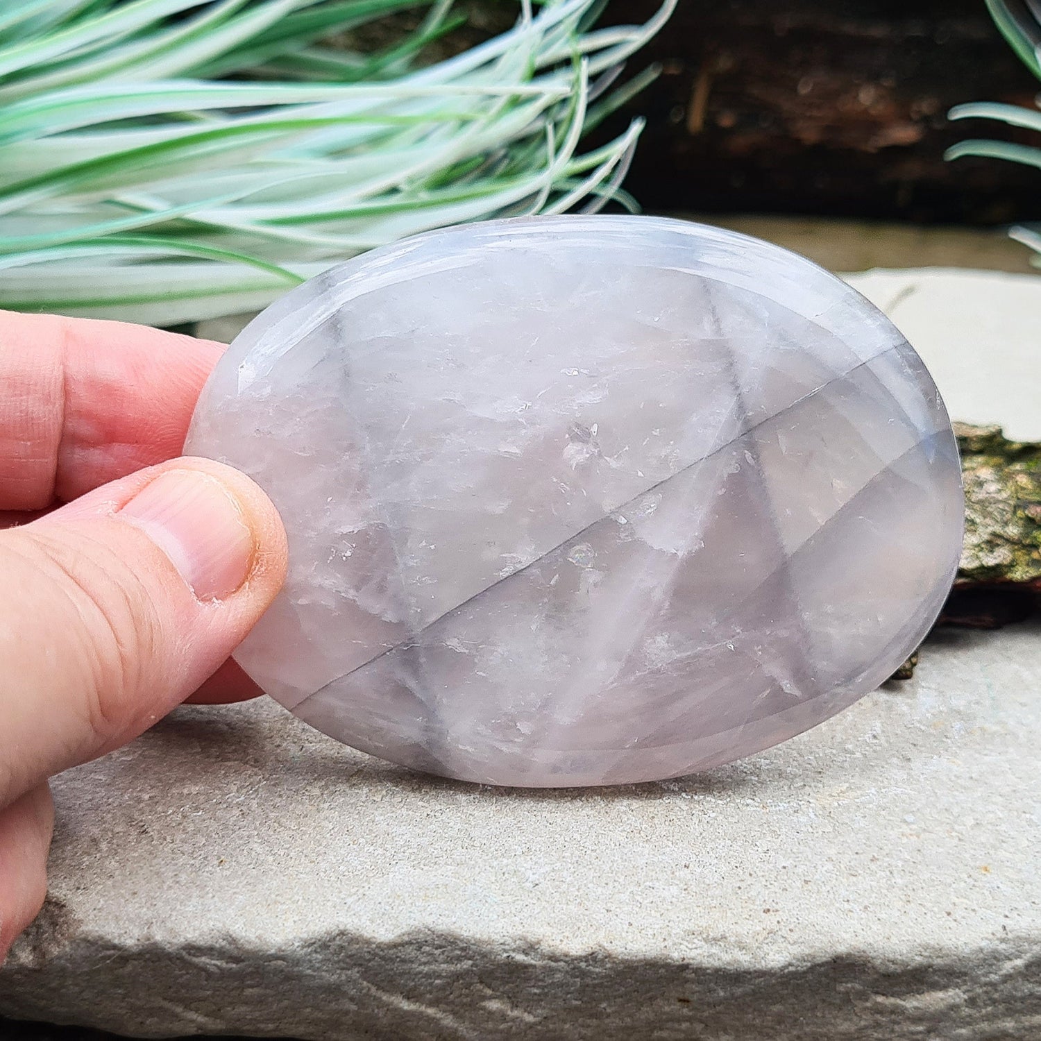 Lunar Quartz Crystal or Lunar Rose Quartz Crystal Palm Stone is from one source in Namibia. It is an infusion of Rose Quartz and Graphite 