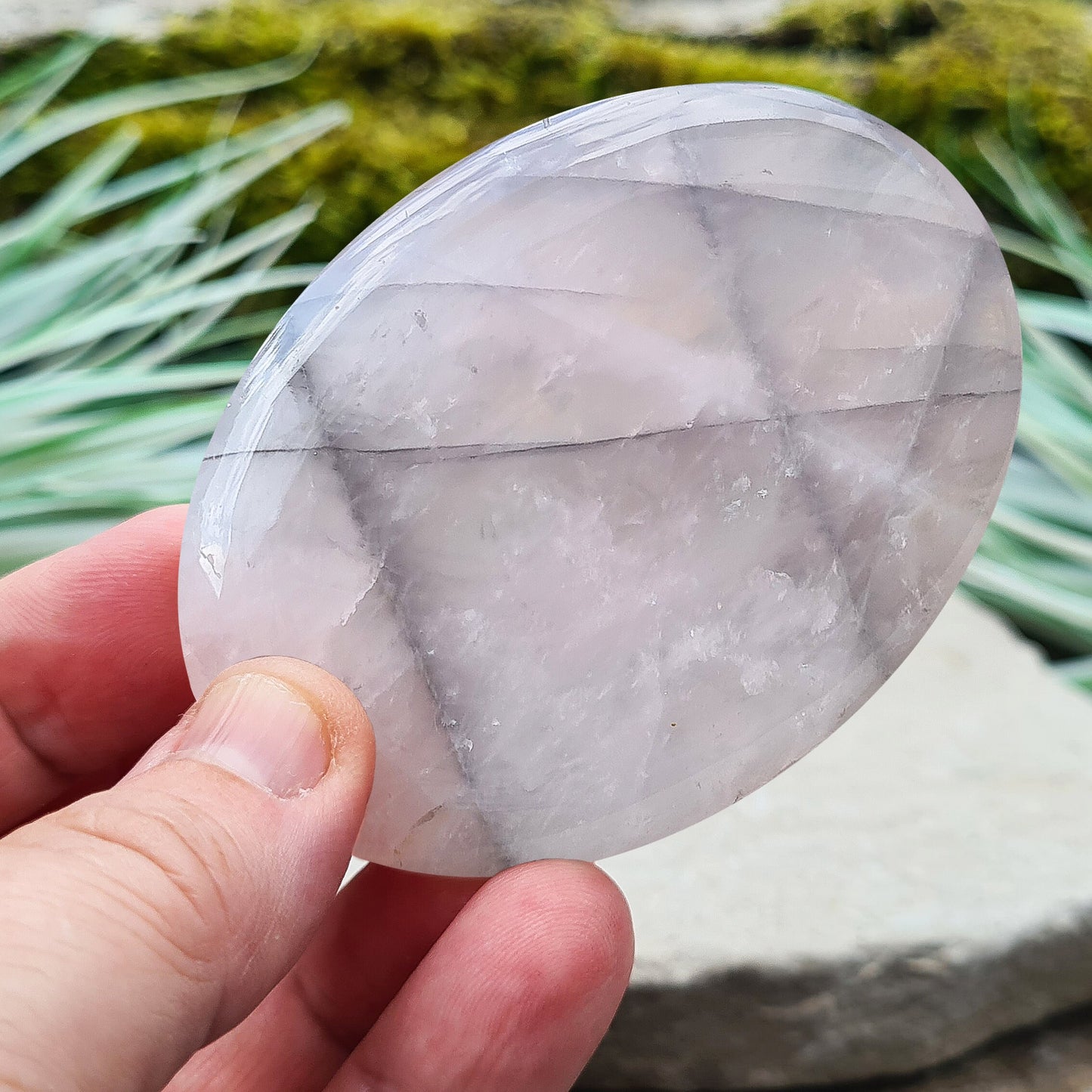 Lunar Quartz Crystal or Lunar Rose Quartz Crystal Palm Stone is from one source in Namibia. It is an infusion of Rose Quartz and Graphite 