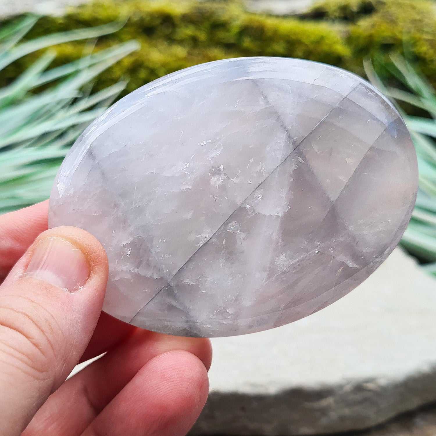 Lunar Quartz Crystal or Lunar Rose Quartz Crystal Palm Stone is from one source in Namibia. It is an infusion of Rose Quartz and Graphite 