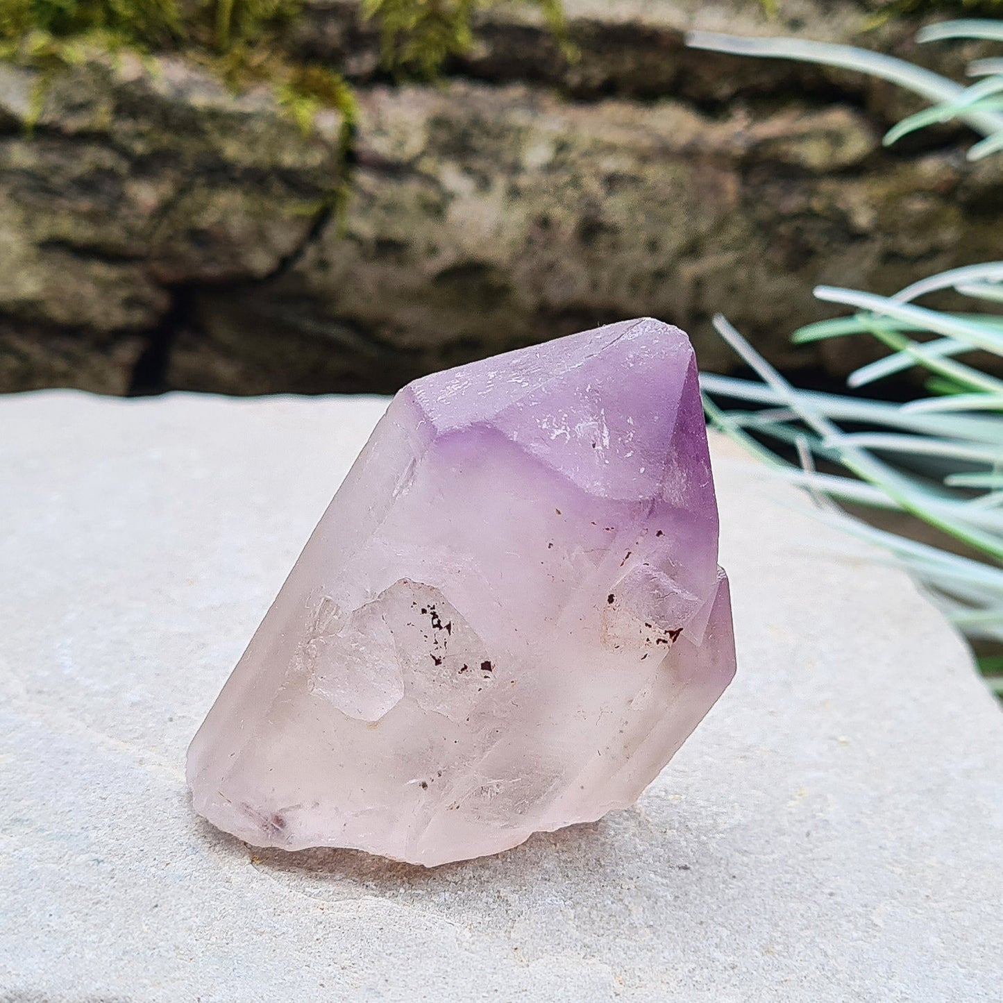 Madagascan Amethyst and Quartz Point. Natural. This point has a companion crystal aside it. Madagascan Amethyst and Quartz have a very different feel and energy to the Quartz and Amethyst that comes out of anywhere else. 