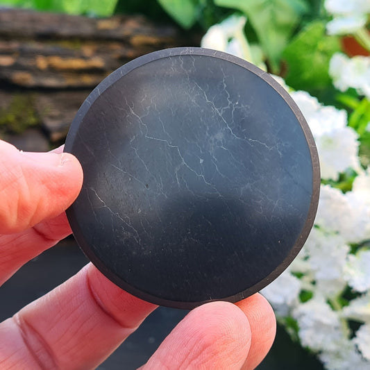 Shungite Disc or Shungite Circular Plate originates from the Karelia region of Russia. Polished smooth.