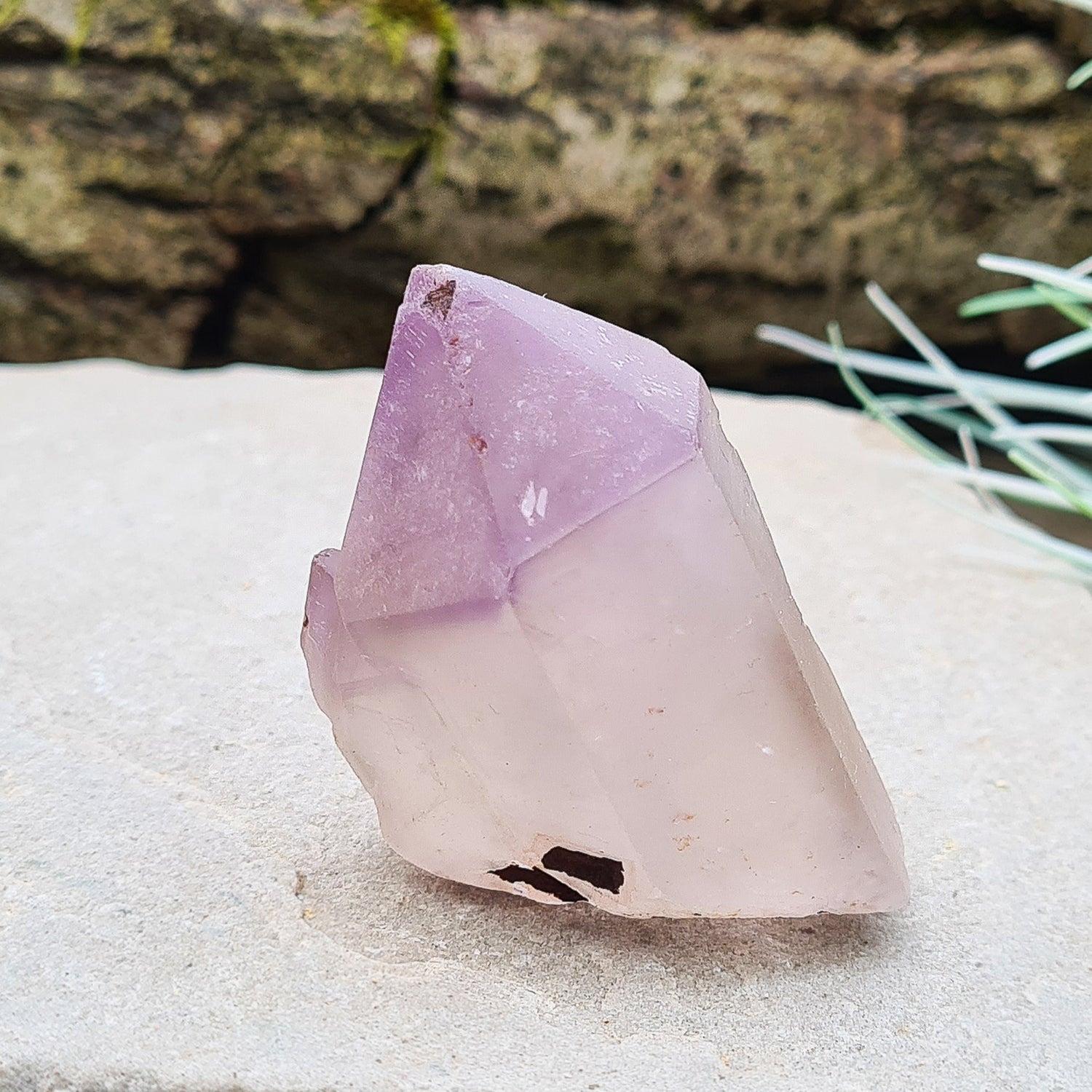 Madagascan Amethyst and Quartz Point. Natural. This point has a companion crystal aside it. Madagascan Amethyst and Quartz have a very different feel and energy to the Quartz and Amethyst that comes out of anywhere else. 