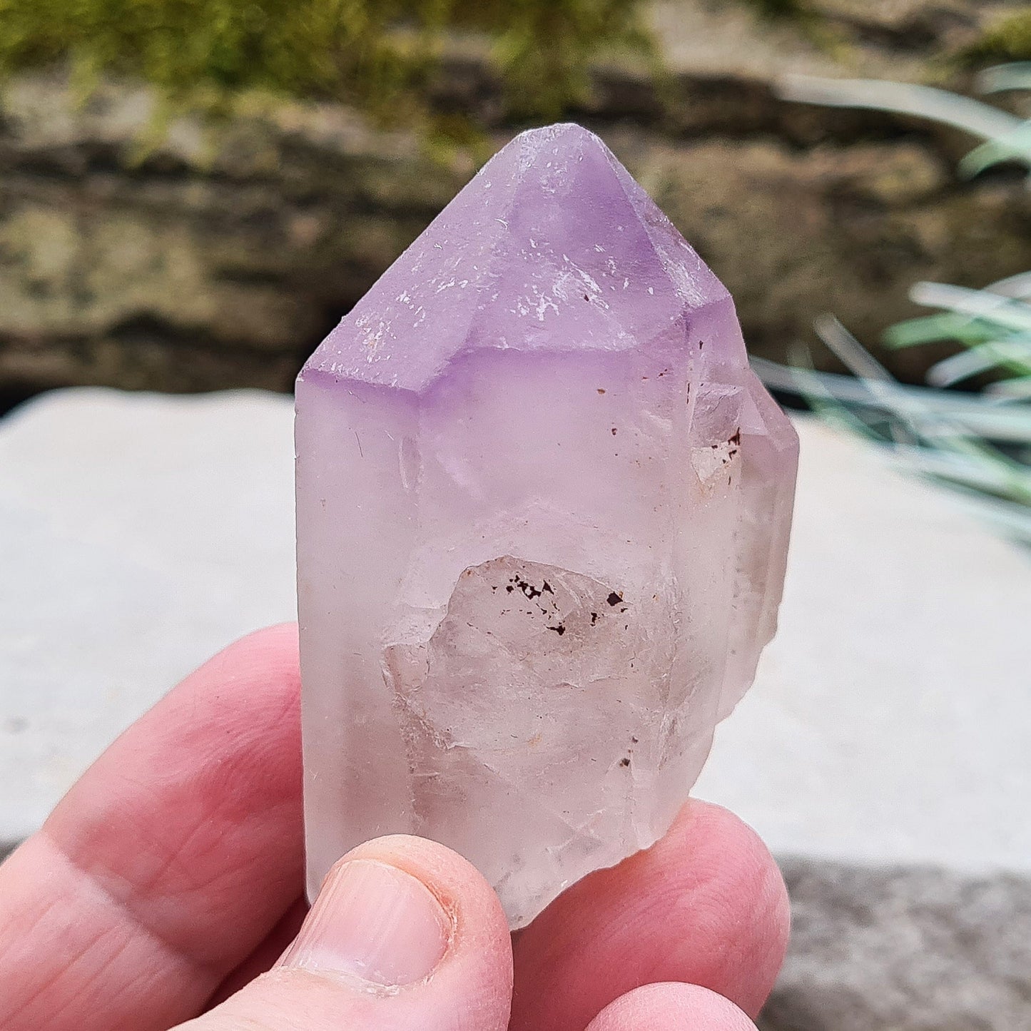 Madagascan Amethyst and Quartz Point. Natural. This point has a companion crystal aside it. Madagascan Amethyst and Quartz have a very different feel and energy to the Quartz and Amethyst that comes out of anywhere else. 