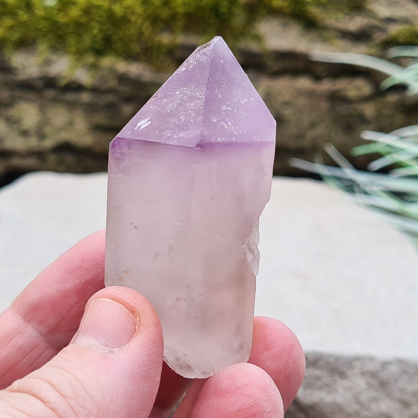 Madagascan Amethyst and Quartz Point. Natural. This point has a companion crystal aside it. Madagascan Amethyst and Quartz have a very different feel and energy to the Quartz and Amethyst that comes out of anywhere else. 