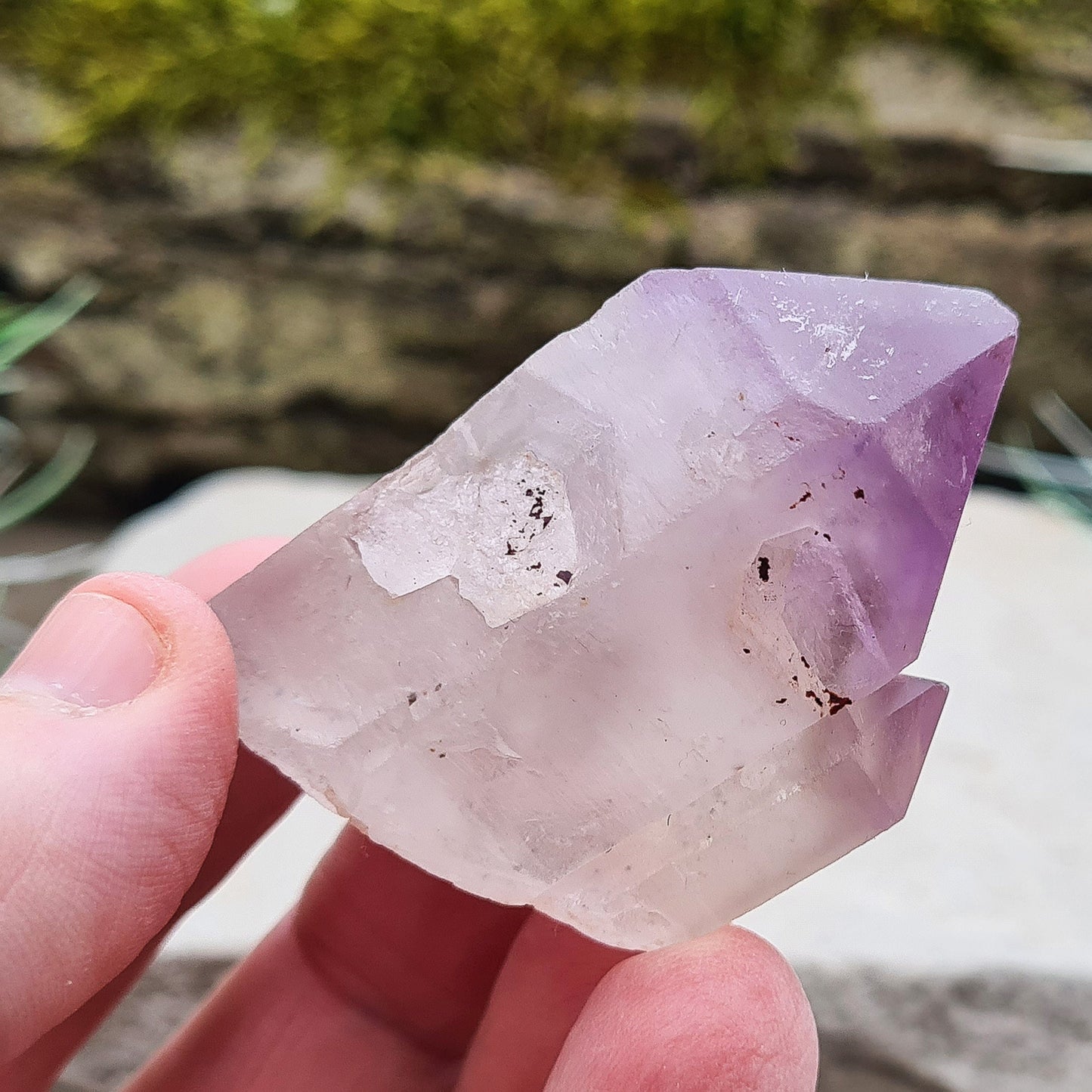 Madagascan Amethyst and Quartz Point. Natural. This point has a companion crystal aside it. Madagascan Amethyst and Quartz have a very different feel and energy to the Quartz and Amethyst that comes out of anywhere else. 