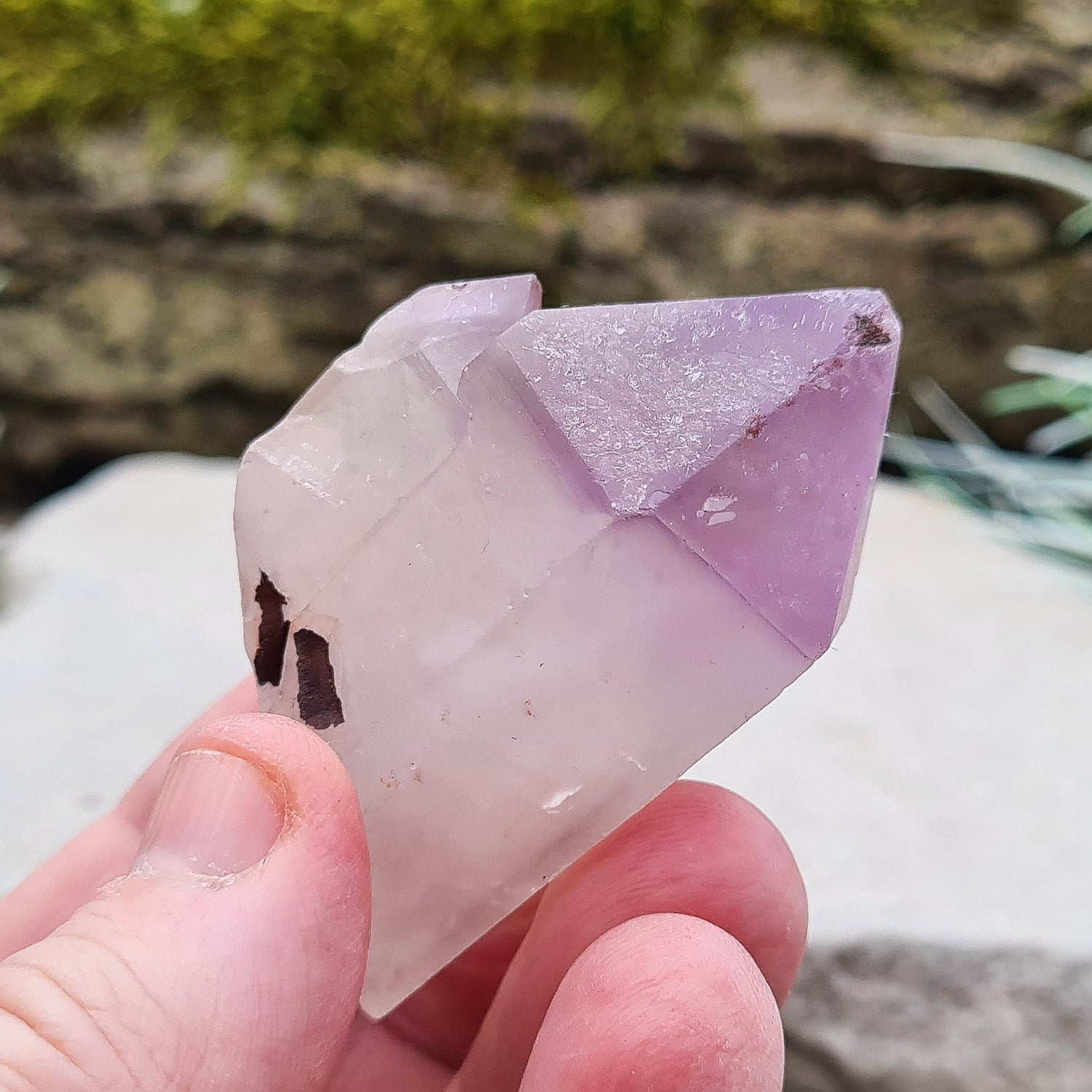 Madagascan Amethyst and Quartz Point. Natural. This point has a companion crystal aside it. Madagascan Amethyst and Quartz have a very different feel and energy to the Quartz and Amethyst that comes out of anywhere else. 