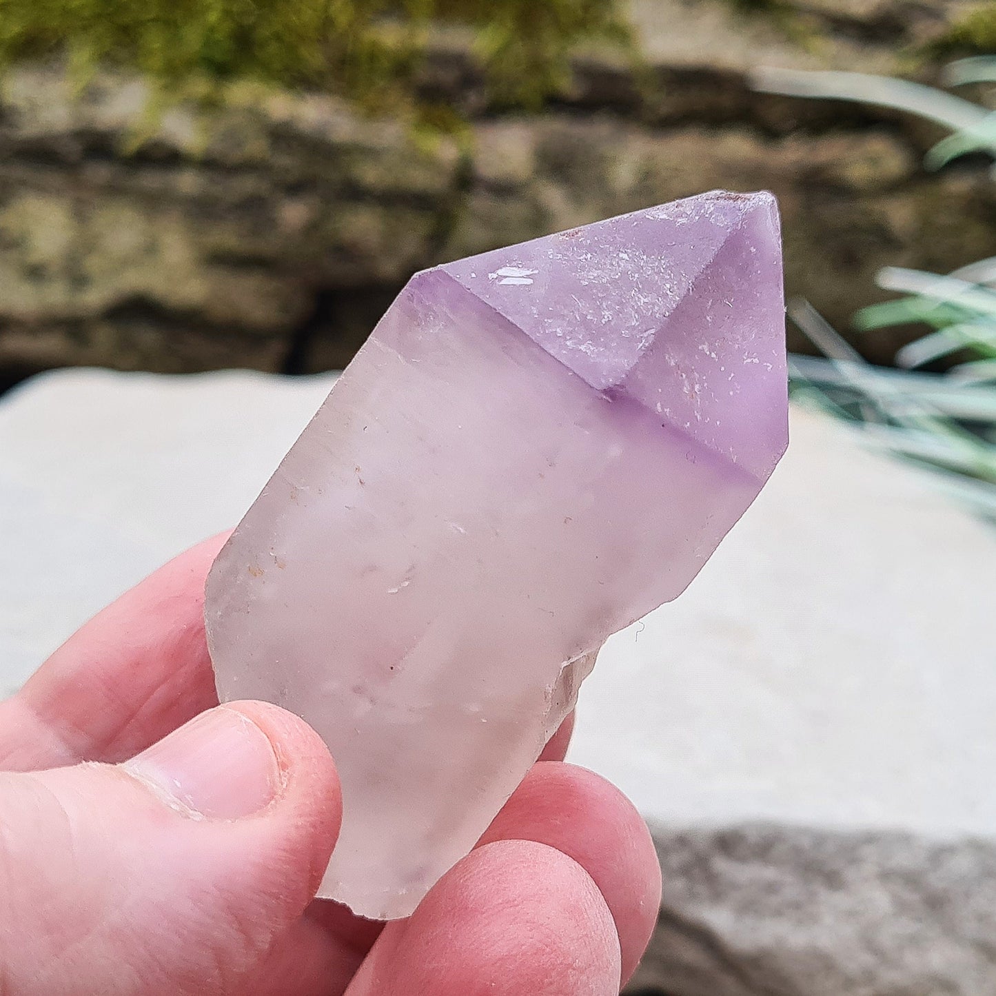 Madagascan Amethyst and Quartz Point. Natural. This point has a companion crystal aside it. Madagascan Amethyst and Quartz have a very different feel and energy to the Quartz and Amethyst that comes out of anywhere else. 