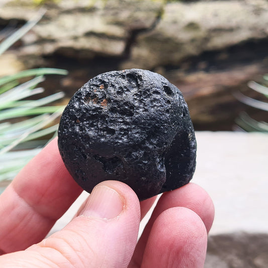 Black Indochinite Tektite, A Grade. A dark black tektite formed from meteorite impact, with a glass-like structure. Estimated to be 700,000 years old, these tektites are found in the Indochinese peninsula, stretching from Australia to China and Indonesia.