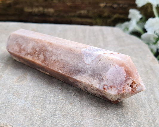 This beautiful double terminated PINK AMETHYST crystal wand from Brazil features soft pink and white colouring with delicate patterns. With generator points on both ends, it can both send and receive energy, helping to bring balance and flow.