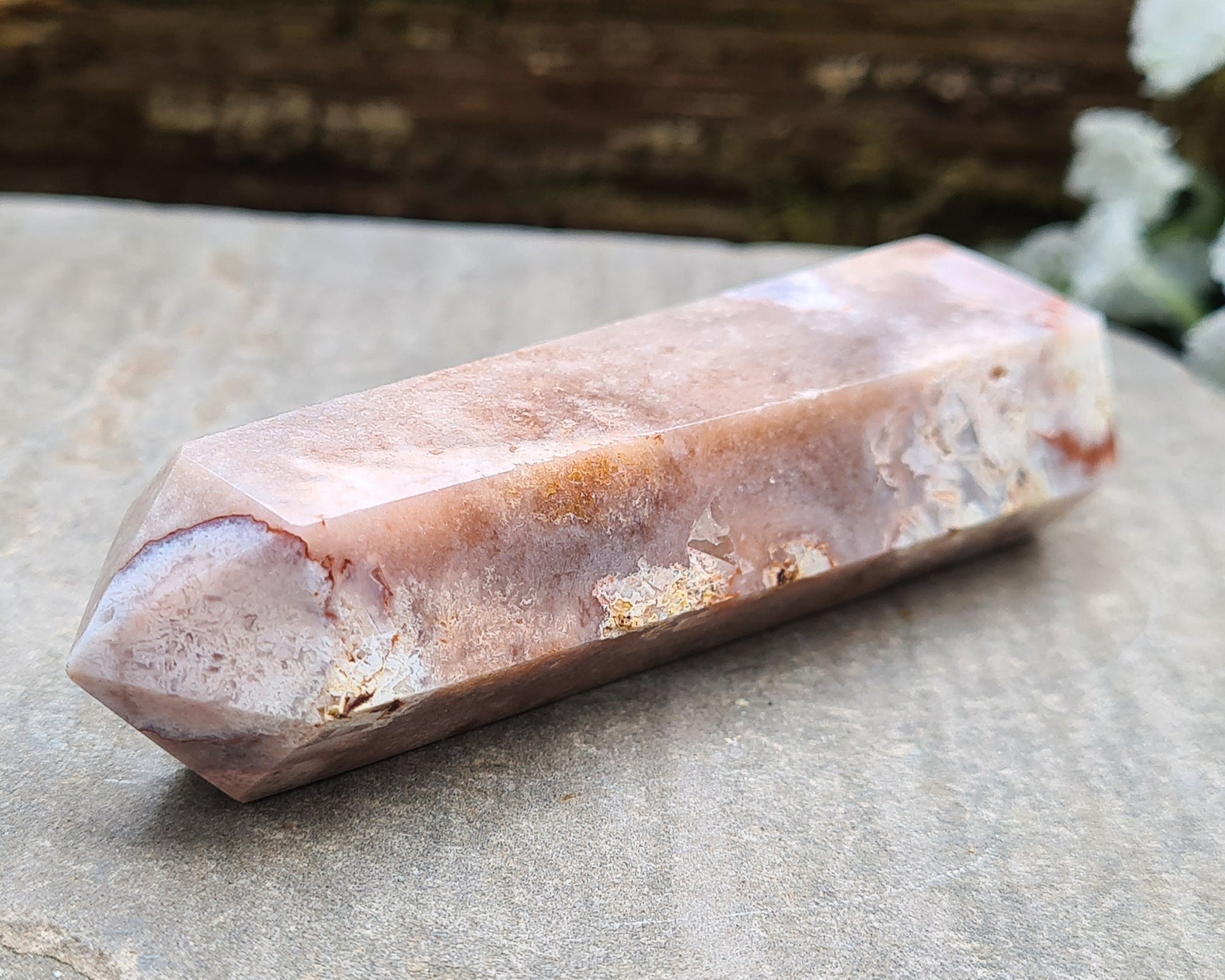 This beautiful double terminated PINK AMETHYST crystal wand from Brazil features soft pink and white colouring with delicate patterns. With generator points on both ends, it can both send and receive energy, helping to bring balance and flow.