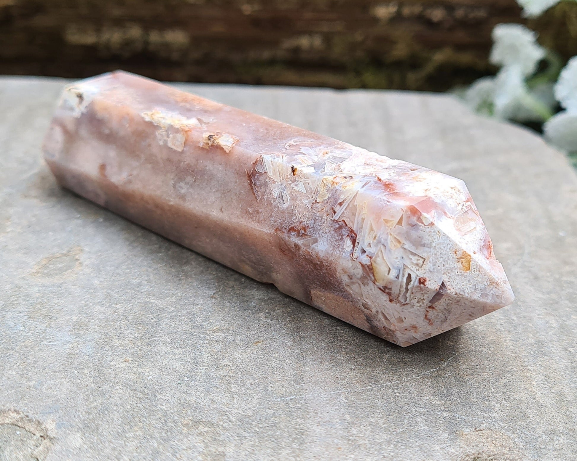 This beautiful double terminated PINK AMETHYST crystal wand from Brazil features soft pink and white colouring with delicate patterns. With generator points on both ends, it can both send and receive energy, helping to bring balance and flow.