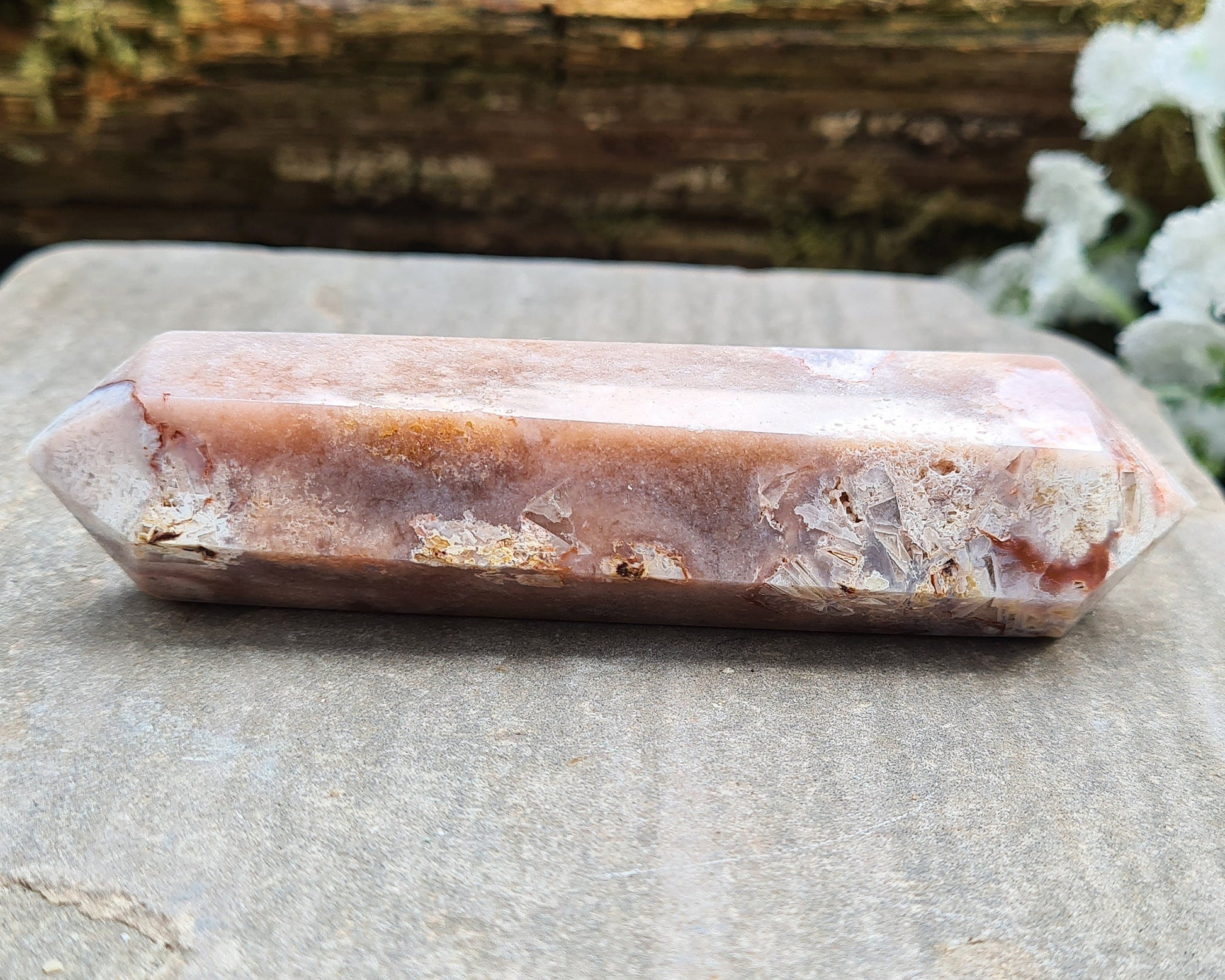 This beautiful double terminated PINK AMETHYST crystal wand from Brazil features soft pink and white colouring with delicate patterns. With generator points on both ends, it can both send and receive energy, helping to bring balance and flow.