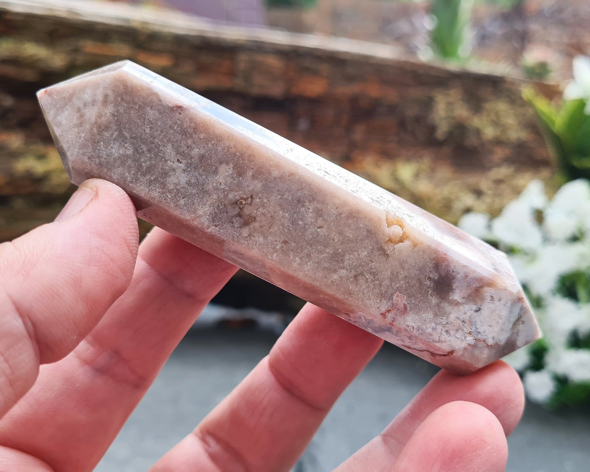 This beautiful double terminated PINK AMETHYST crystal wand from Brazil features soft pink and white colouring with delicate patterns. With generator points on both ends, it can both send and receive energy, helping to bring balance and flow.