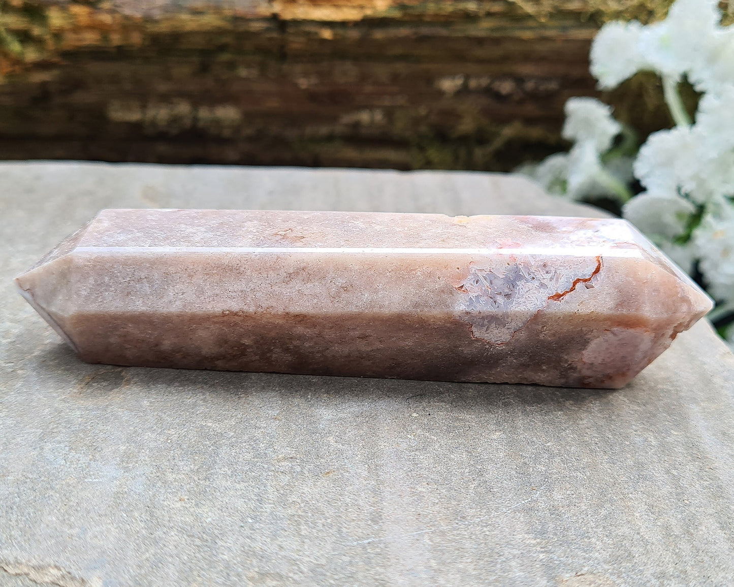 This beautiful double terminated PINK AMETHYST crystal wand from Brazil features soft pink and white colouring with delicate patterns. With generator points on both ends, it can both send and receive energy, helping to bring balance and flow.