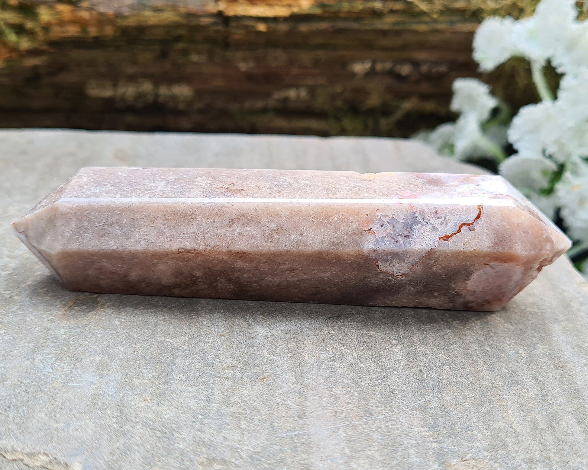 This beautiful double terminated PINK AMETHYST crystal wand from Brazil features soft pink and white colouring with delicate patterns. With generator points on both ends, it can both send and receive energy, helping to bring balance and flow.