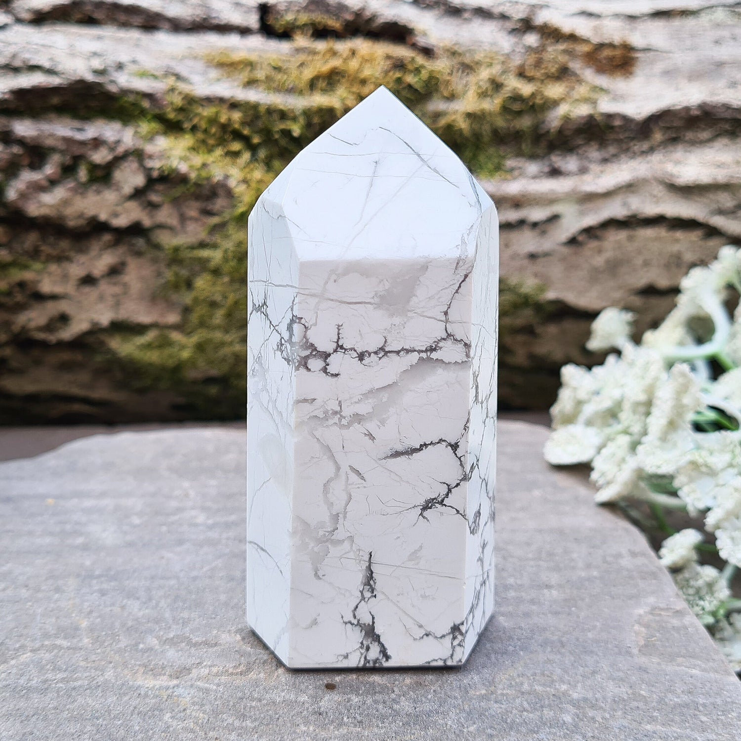 Howlite Crystal Point. Off white with grey marble like patterning, nicely polished. 