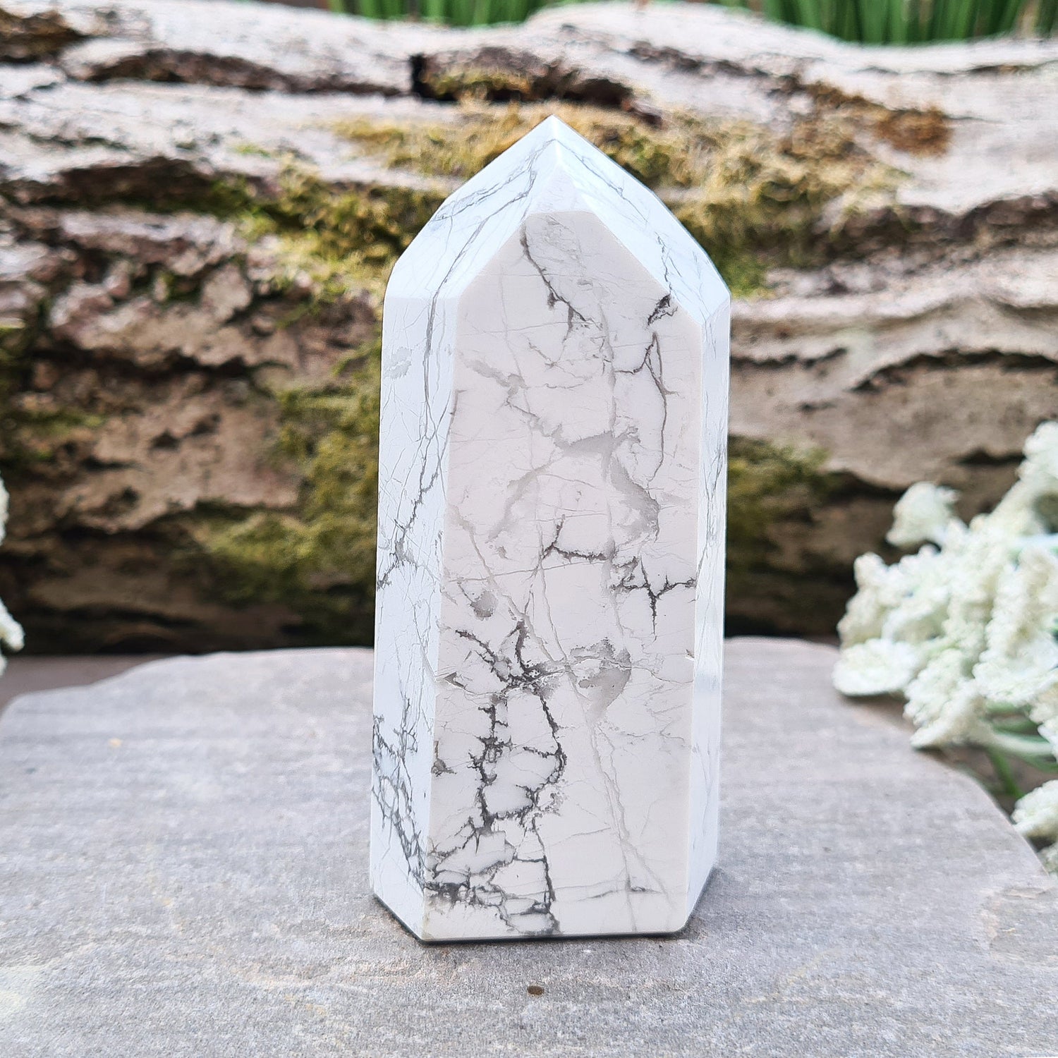 Howlite Crystal Point. Off white with grey marble like patterning, nicely polished. 