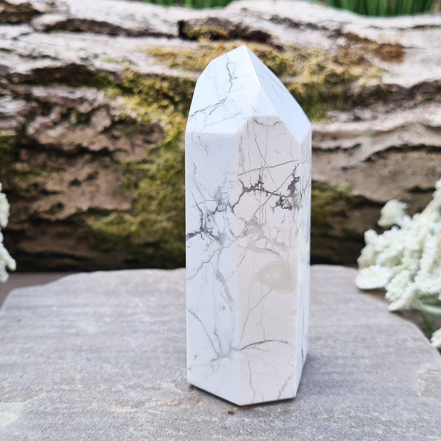 Howlite Crystal Point. Off white with grey marble like patterning, nicely polished. 