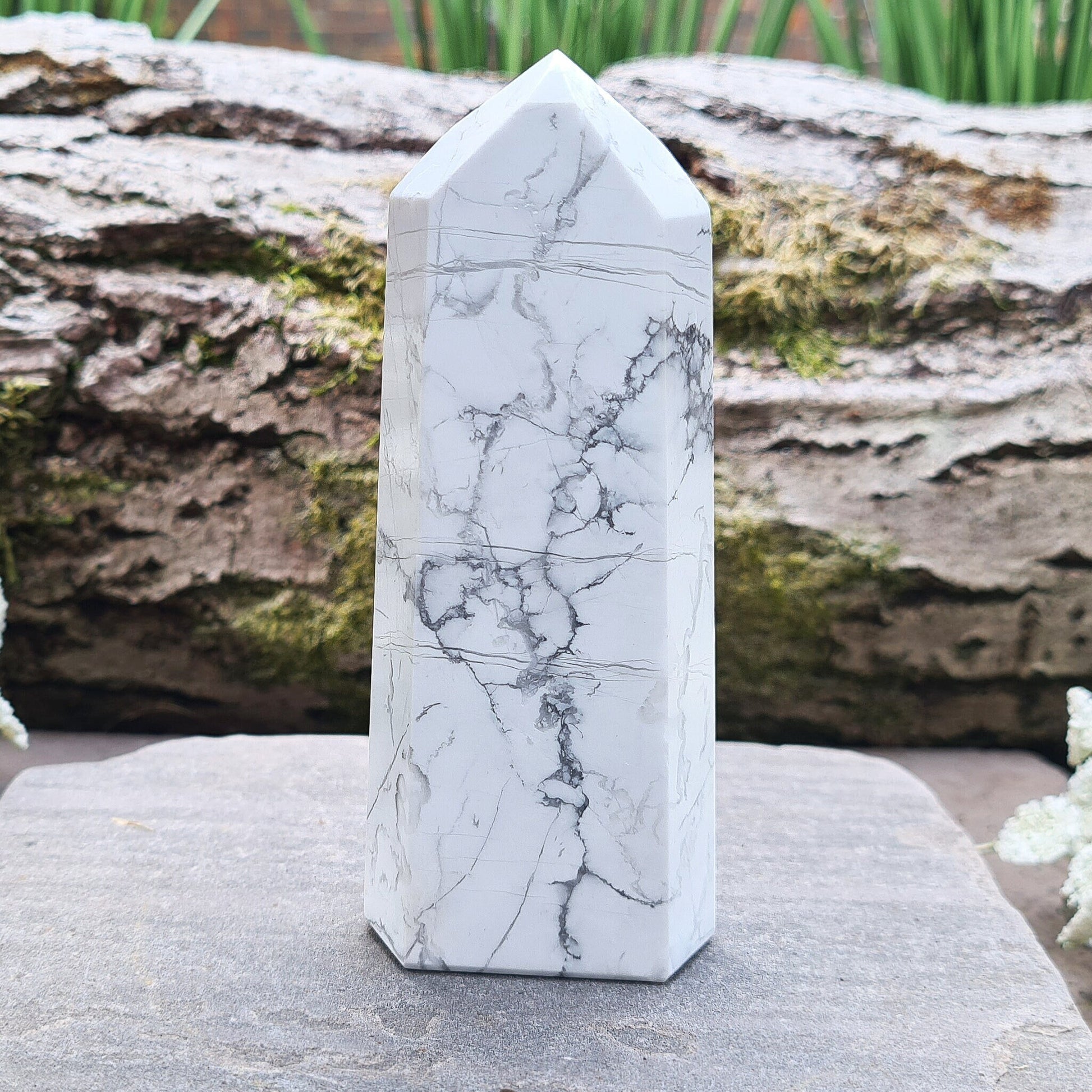 Howlite Crystal Point. Off white with grey marble like patterning, nicely polished. 