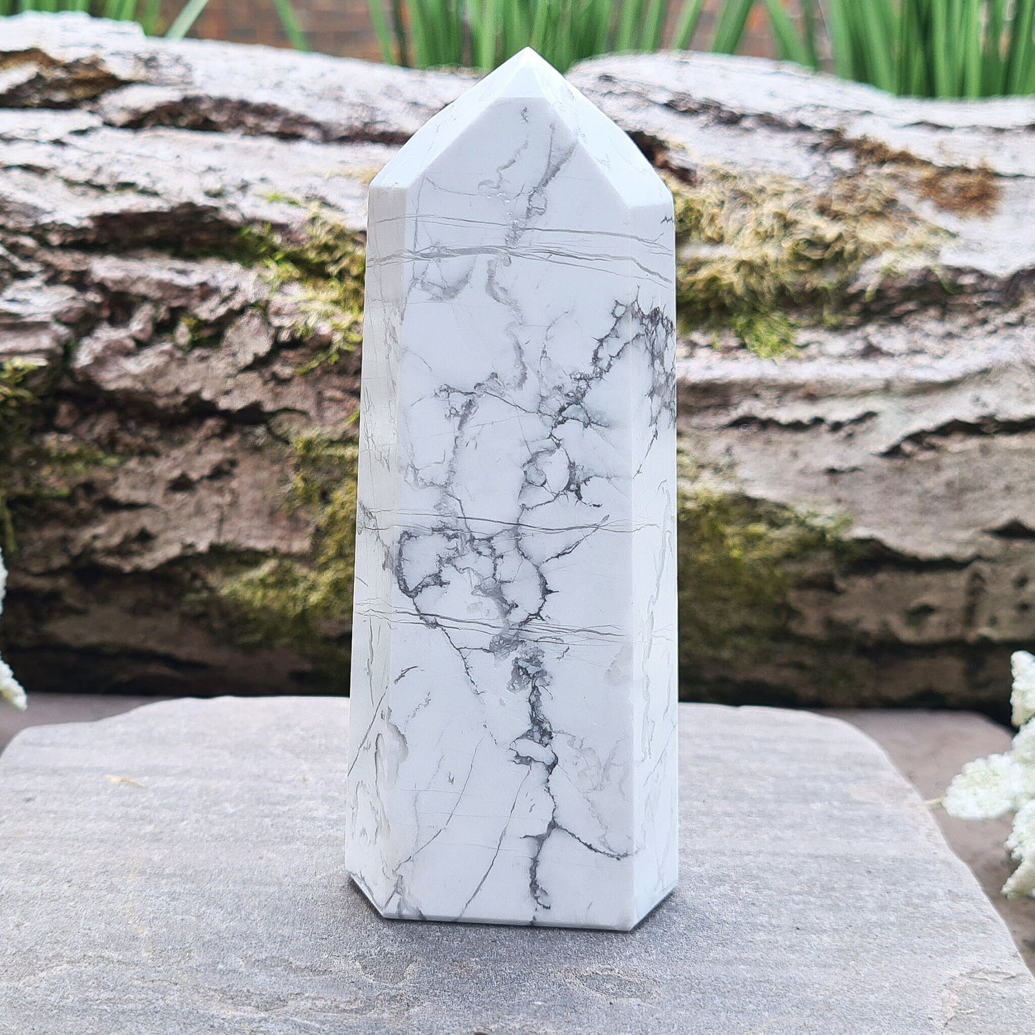 Howlite Crystal Point. Off white with grey marble like patterning, nicely polished. My supplier has an exclusivity arrangement with the mine that produces this stone so they get the best quality.