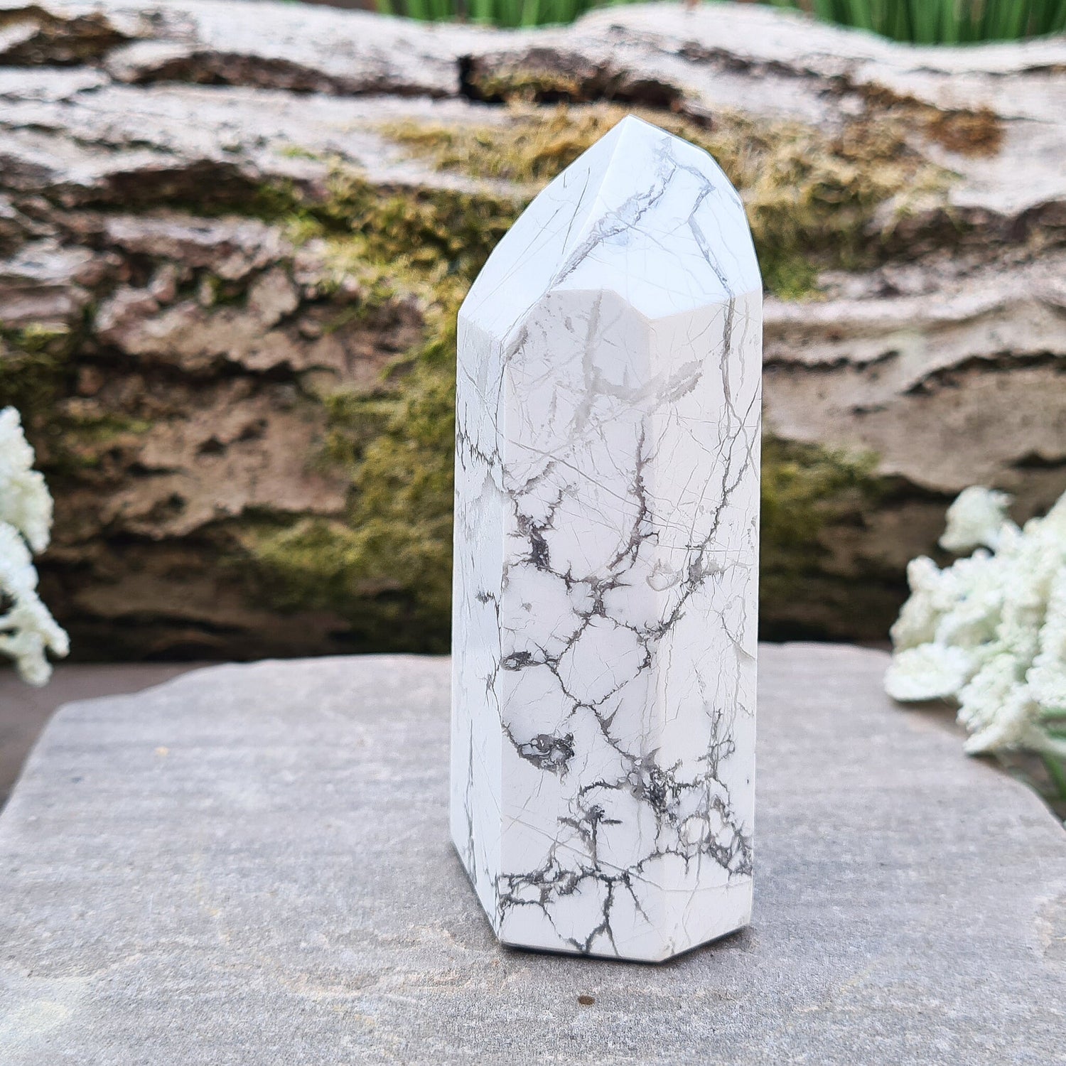 Howlite Crystal Point. Off white with grey marble like patterning, nicely polished. 