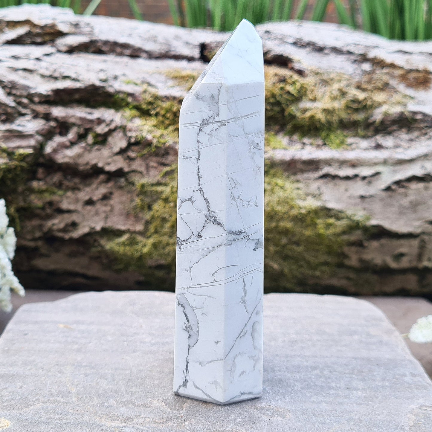 Howlite Crystal Point. Off white with grey marble like patterning, nicely polished. My supplier has an exclusivity arrangement with the mine that produces this stone so they get the best quality.