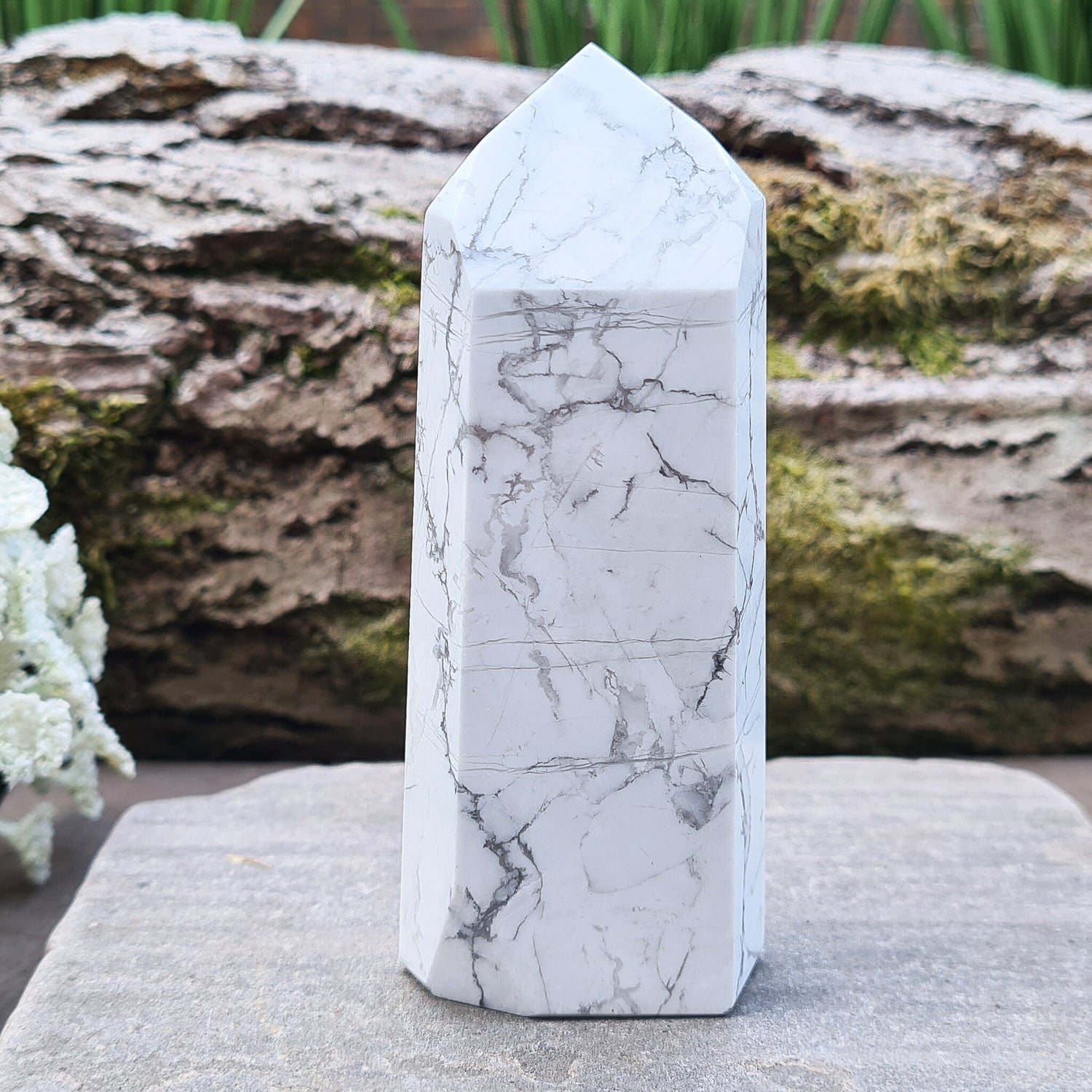 Howlite Crystal Point. Off white with grey marble like patterning, nicely polished. My supplier has an exclusivity arrangement with the mine that produces this stone so they get the best quality.