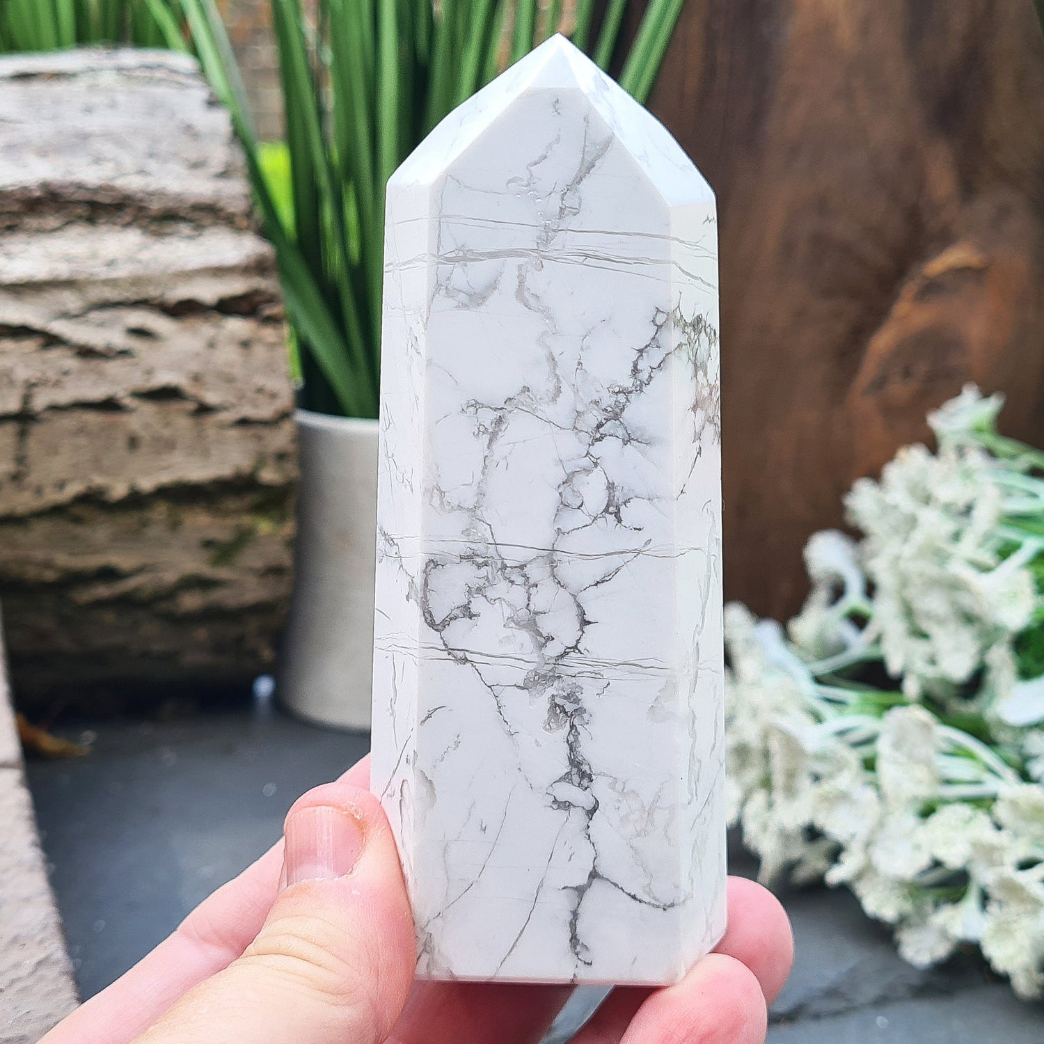 Howlite Crystal Point. Off white with grey marble like patterning, nicely polished. My supplier has an exclusivity arrangement with the mine that produces this stone so they get the best quality.