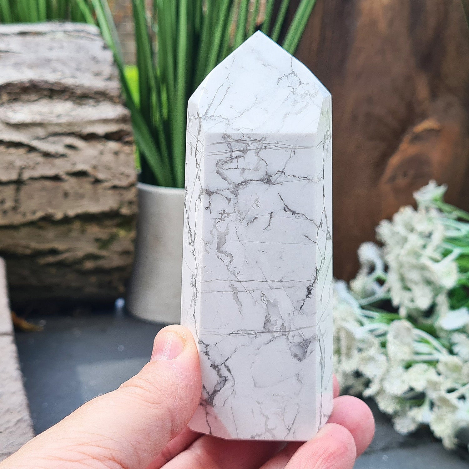 Howlite Crystal Point. Off white with grey marble like patterning, nicely polished. My supplier has an exclusivity arrangement with the mine that produces this stone so they get the best quality.