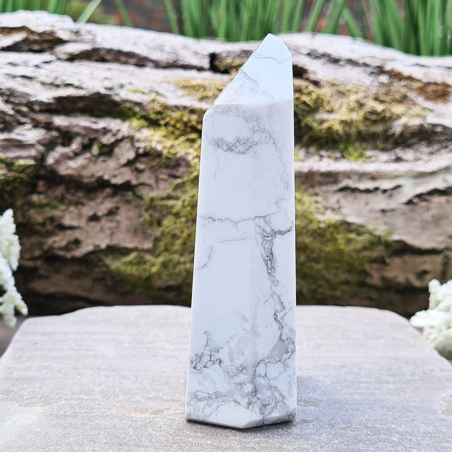 Howlite Crystal Point. Off white with grey marble like patterning, nicely polished. 