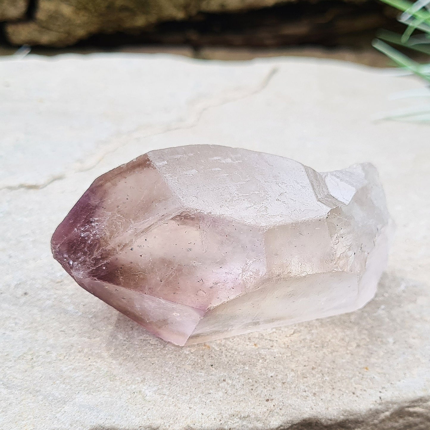 Madagascan Amethyst and Quartz Point. Natural. Once face has an Isis face, Madagascan Amethyst and Quartz have a very different feel and energy to the Quartz and Amethyst that comes out of anywhere else. This crystal is just gorgeous. It has a smokiness in the tip to it as well.