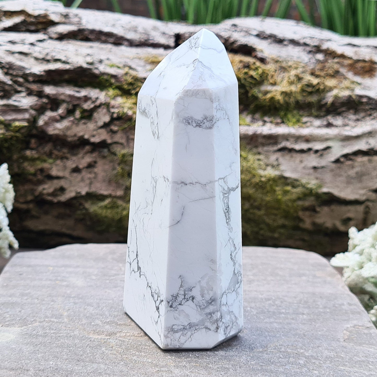 Howlite Crystal Point. Off white with grey marble like patterning, nicely polished. 