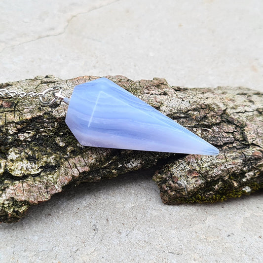 Blue Lace Agate Crystal Pendulum, lovely blue colouring as you would expect from Blue Lace. From South Africa. Pendulum has a chain and ring on the end.