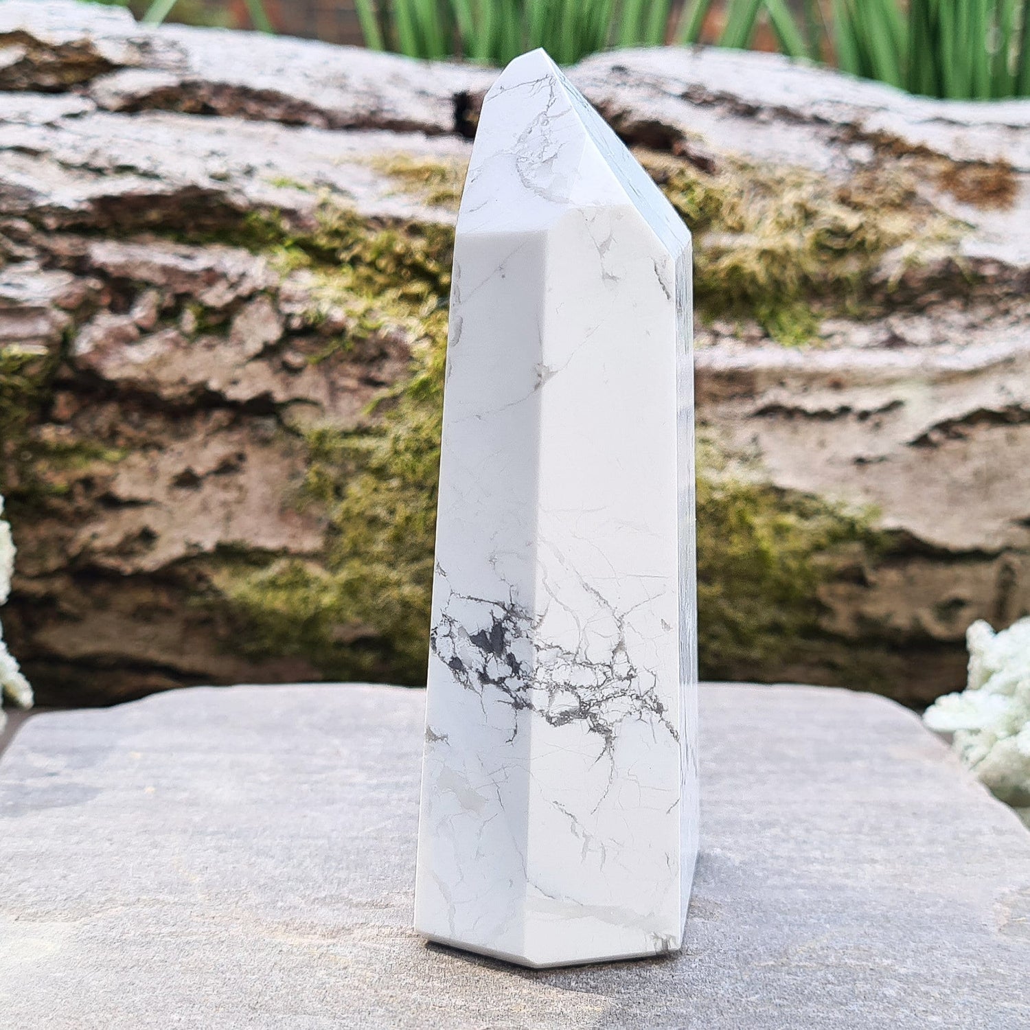 Howlite Crystal Point. Off white with grey marble like patterning, nicely polished. 