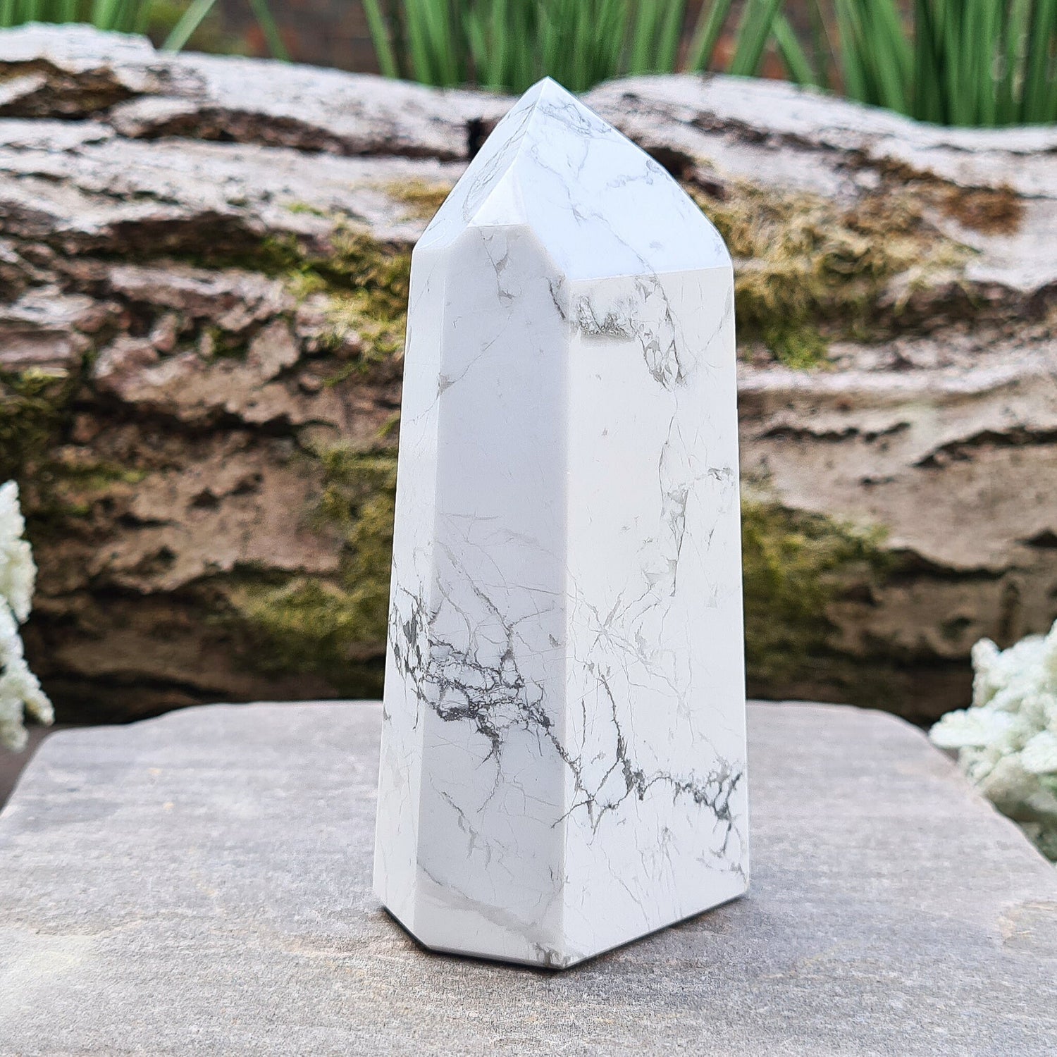 Howlite Crystal Point. Off white with grey marble like patterning, nicely polished. 