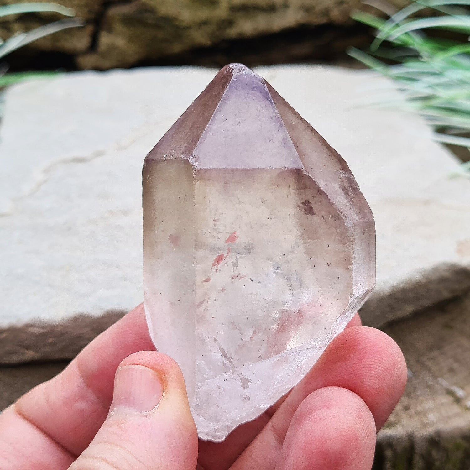 Madagascan Amethyst and Quartz Point. Natural. Once face has an Isis face, Madagascan Amethyst and Quartz have a very different feel and energy to the Quartz and Amethyst that comes out of anywhere else. This crystal is just gorgeous. It has a smokiness in the tip to it as well.