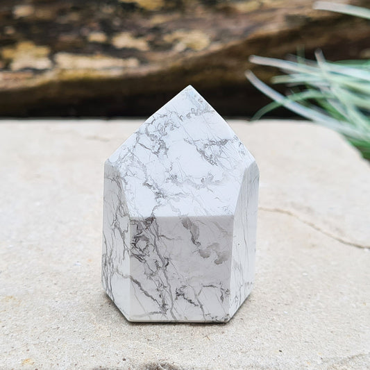 Howlite Crystal Point. Off White with grey marble like patterning, nicely polished. High grade. From Brazil.