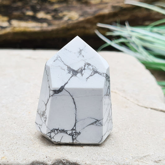 Howlite Crystal Point. Off White with grey marble like patterning, nicely polished. High grade. From Brazil.