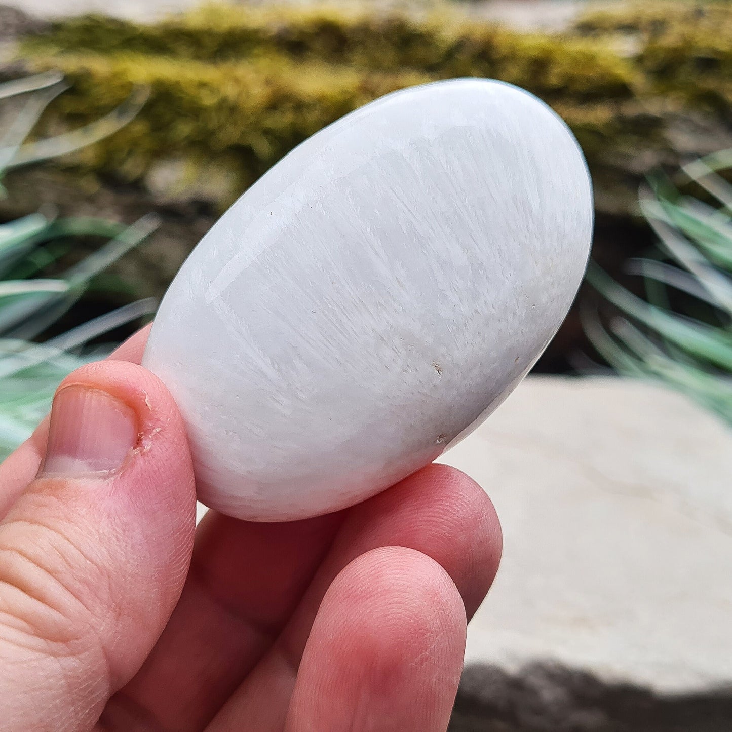 Scolecite Crystal Palm Stone. Scolecite is a high vibrational stone with a soft and gentle energy.