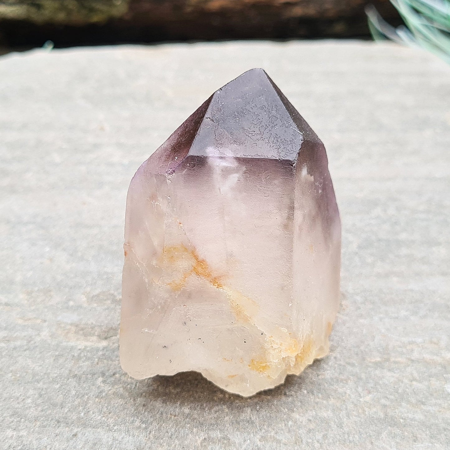 Madagascar Quartz with Amethyst Tip: Clear your aura, balance chakras, enhance intuition, and promote emotional well-being with this unique crystal.
