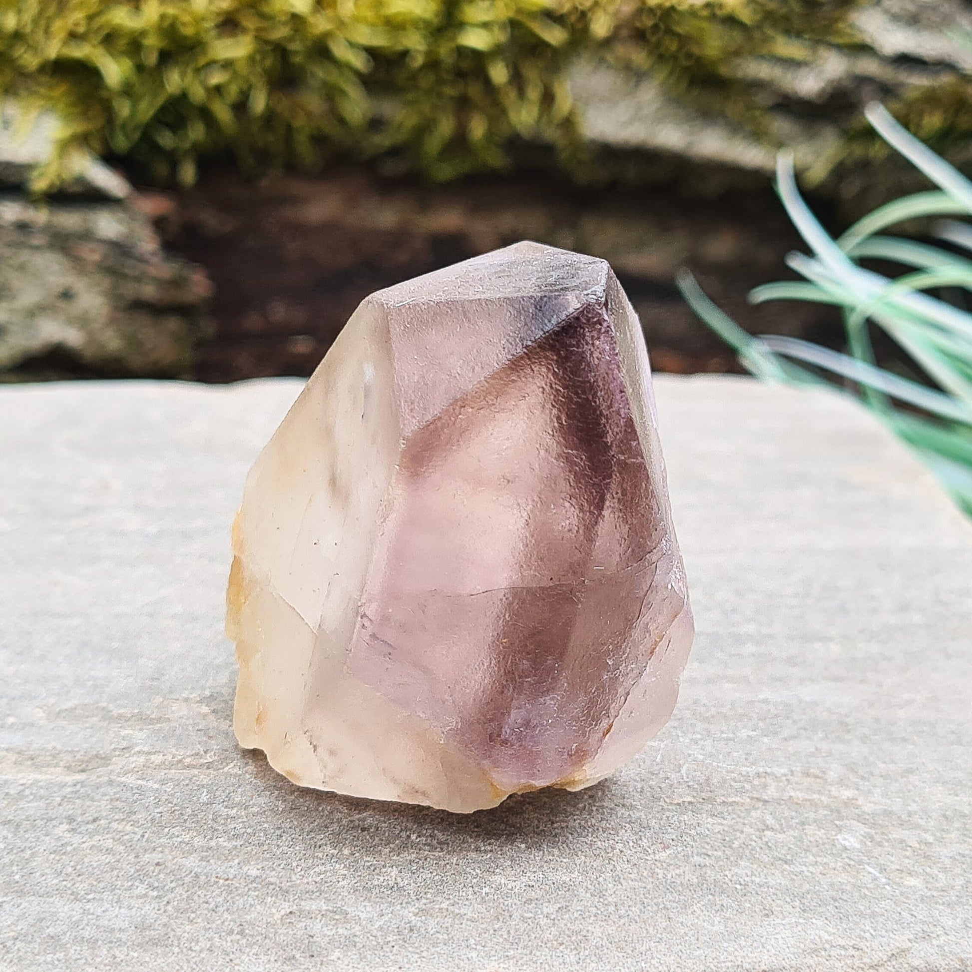 Madagascar Quartz with Amethyst Tip: Clear your aura, balance chakras, enhance intuition, and promote emotional well-being with this unique crystal.