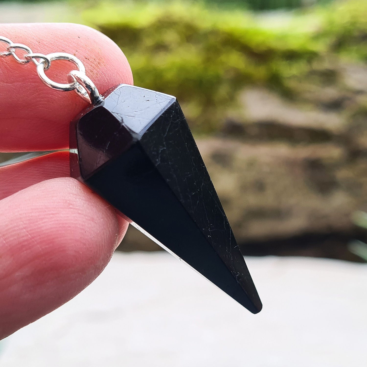 Black Tourmaline Crystal Pendulum. Also known as Schorl. Will come in a box or pouch to keep it in.
Length of crystal pendulum excluding chain 3.6 cm.