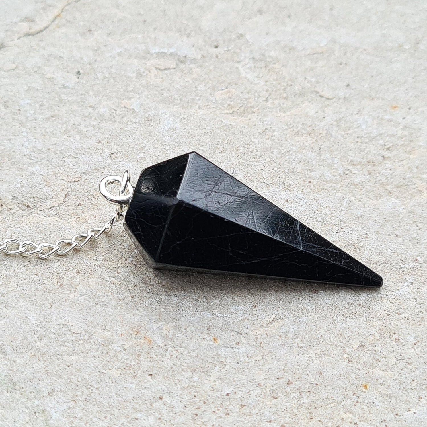 Black Tourmaline Crystal Pendulum. Will come in a box or pouch to keep it in.