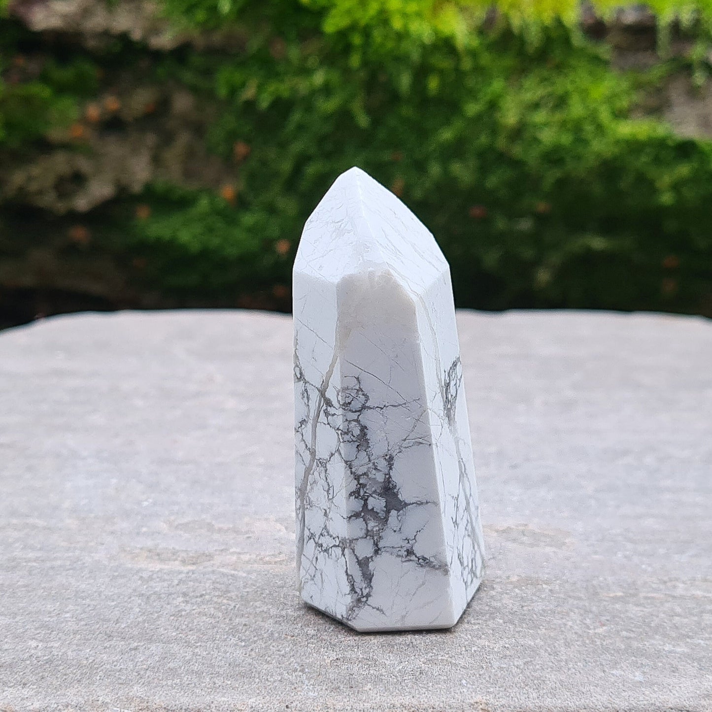 Howlite Point. Off White with grey marble like patterning, nicely polished. High grade.