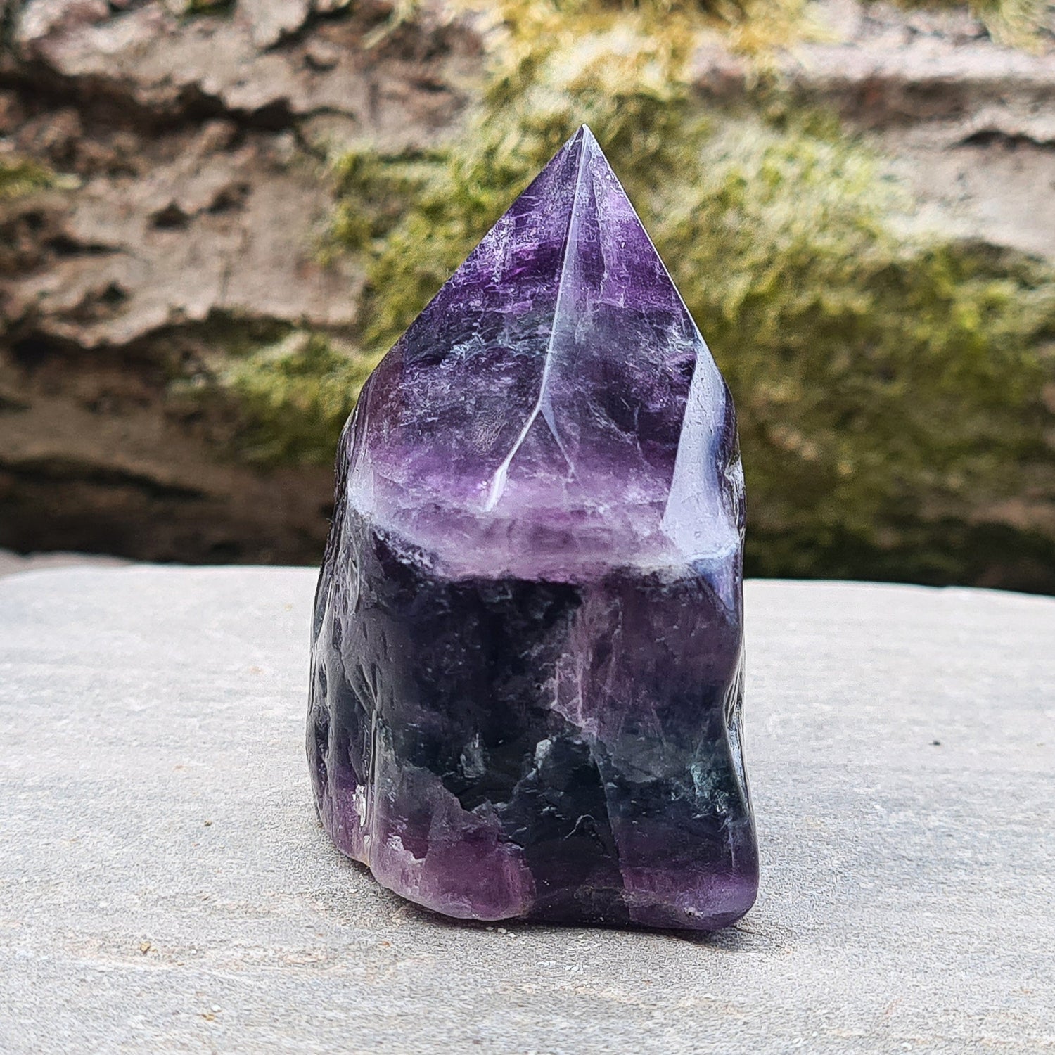 Fluorite Crystal Point. Lovely green and purple colouring. Point is a polished 6 sided, base is also polished 