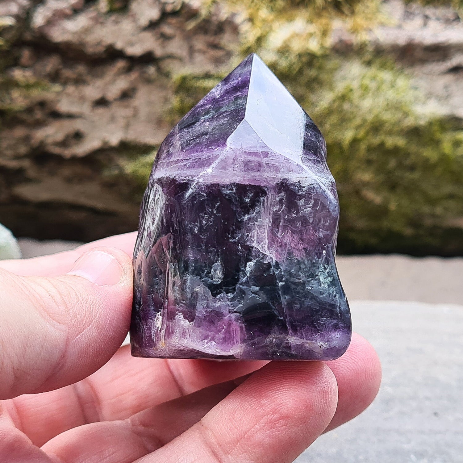 Fluorite Crystal Point. Lovely green and purple colouring. Point is a polished 6 sided, base is also polished 