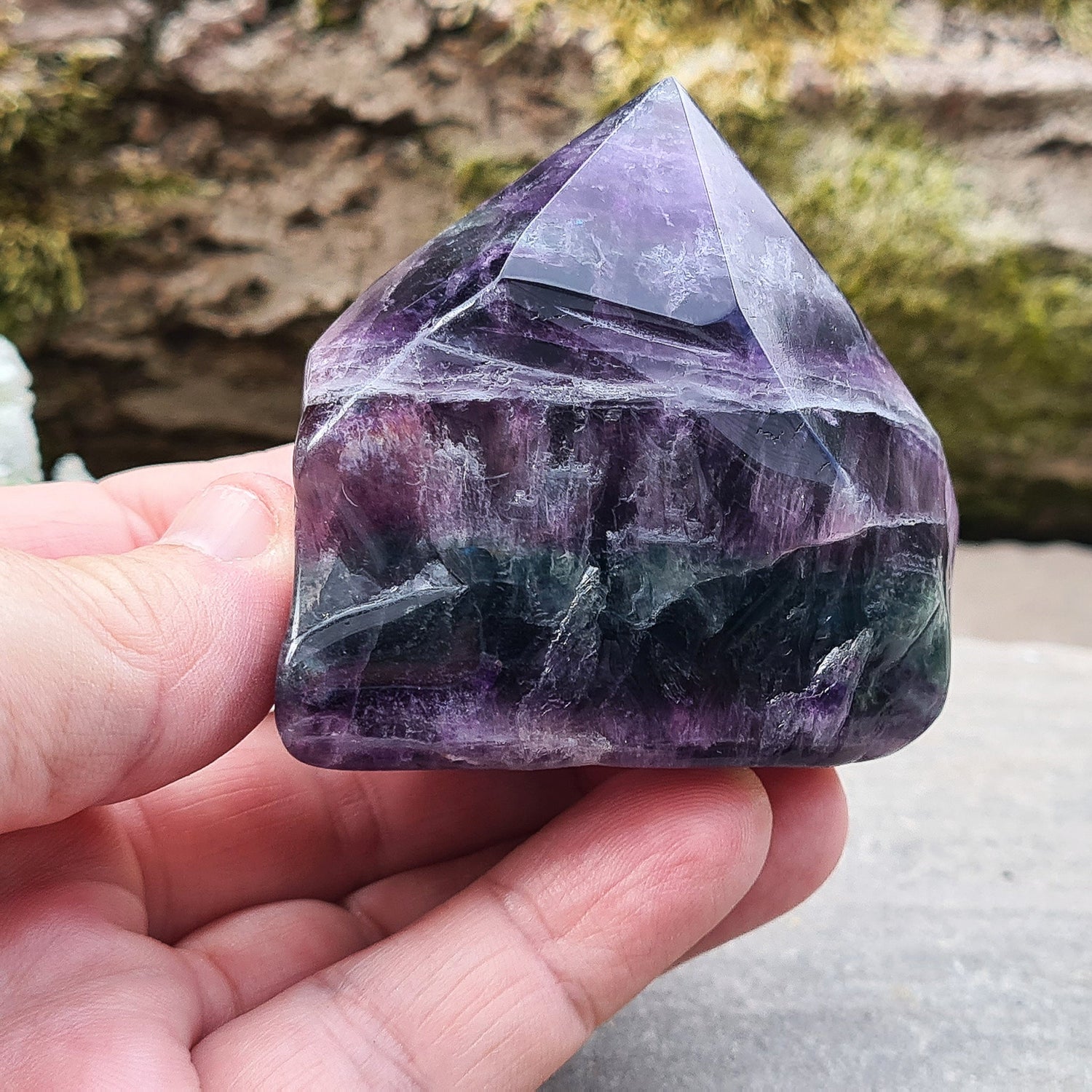 Fluorite Crystal Point. Lovely green and purple colouring. Point is a polished 6 sided, base is also polished 