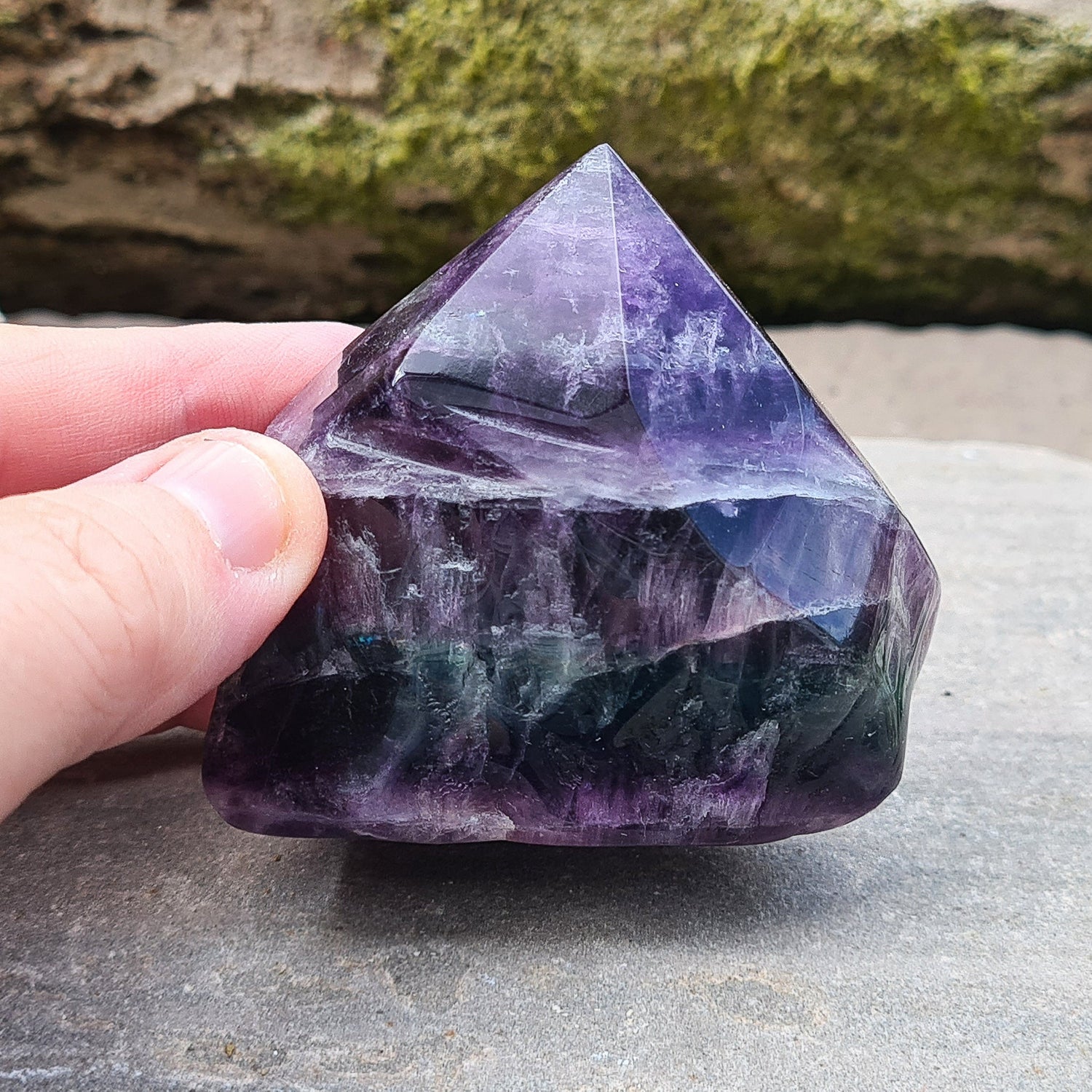 Fluorite Crystal Point. Lovely green and purple colouring. Point is a polished 6 sided, base is also polished 