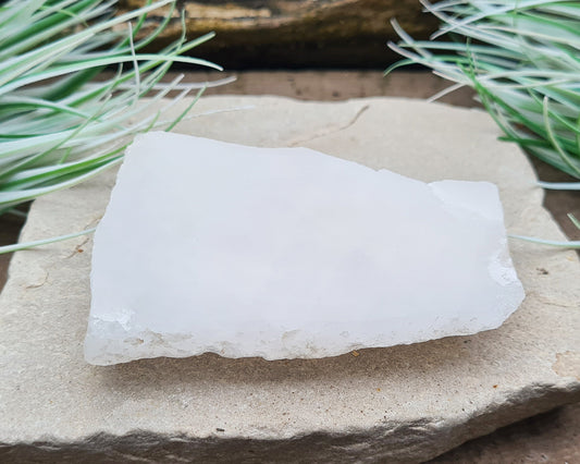 Quartz Crystal Platform from Brazil. This is white quartz, left natural on one side, and cut and smoothed on the other. A Quartz Crystal Platform is a great tool for anyone looking to elevate their spiritual and healing practices.