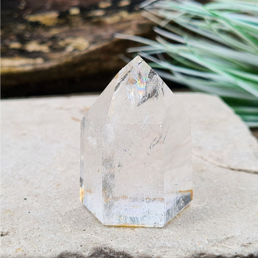 Quartz Crystal Standing Point from Brazil. This is a wonderfully clear quartz point with light reflecting inclusions which create a rainbow in its tip.